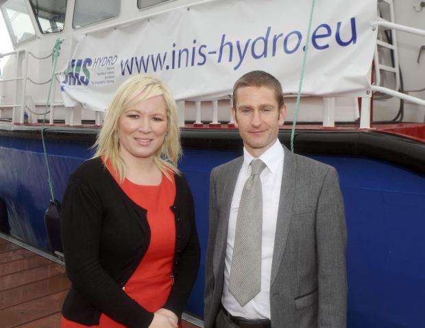 James Strong (AFBI Fisheries and Aquatic Ecosystems Branch) and Michelle O’Neill (Minister of Agriculture and Rural Development NI) pictured in front of the DARD FPV Banrion Ulladh which was used during the survey.