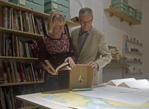 Alice Clark  (Artist- at-Sea) with Walter Crozier (AFBI) reviewing the drawings from her time on board the RV Corystes.