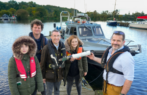 Picture of the DAERA Minister, Andrew Muir at Ballyronan Marina with some of the AFBI Freshwater ResearchTeam