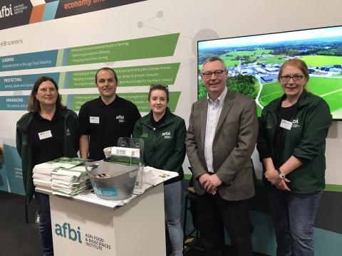 AFBI CEO Dr Stanley McDowell with staff on the AFBI stand